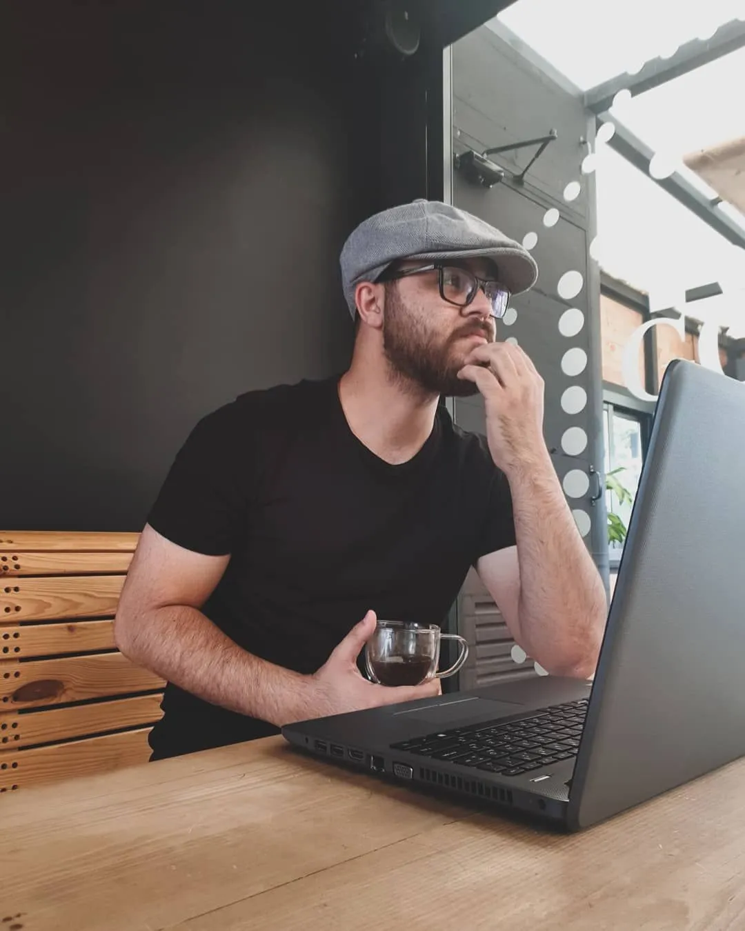 Person typing on a laptop contributing to remote animal rescue volunteer tasks